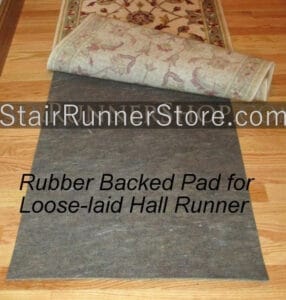 Rubber backed pad for a loose-laid hall runner